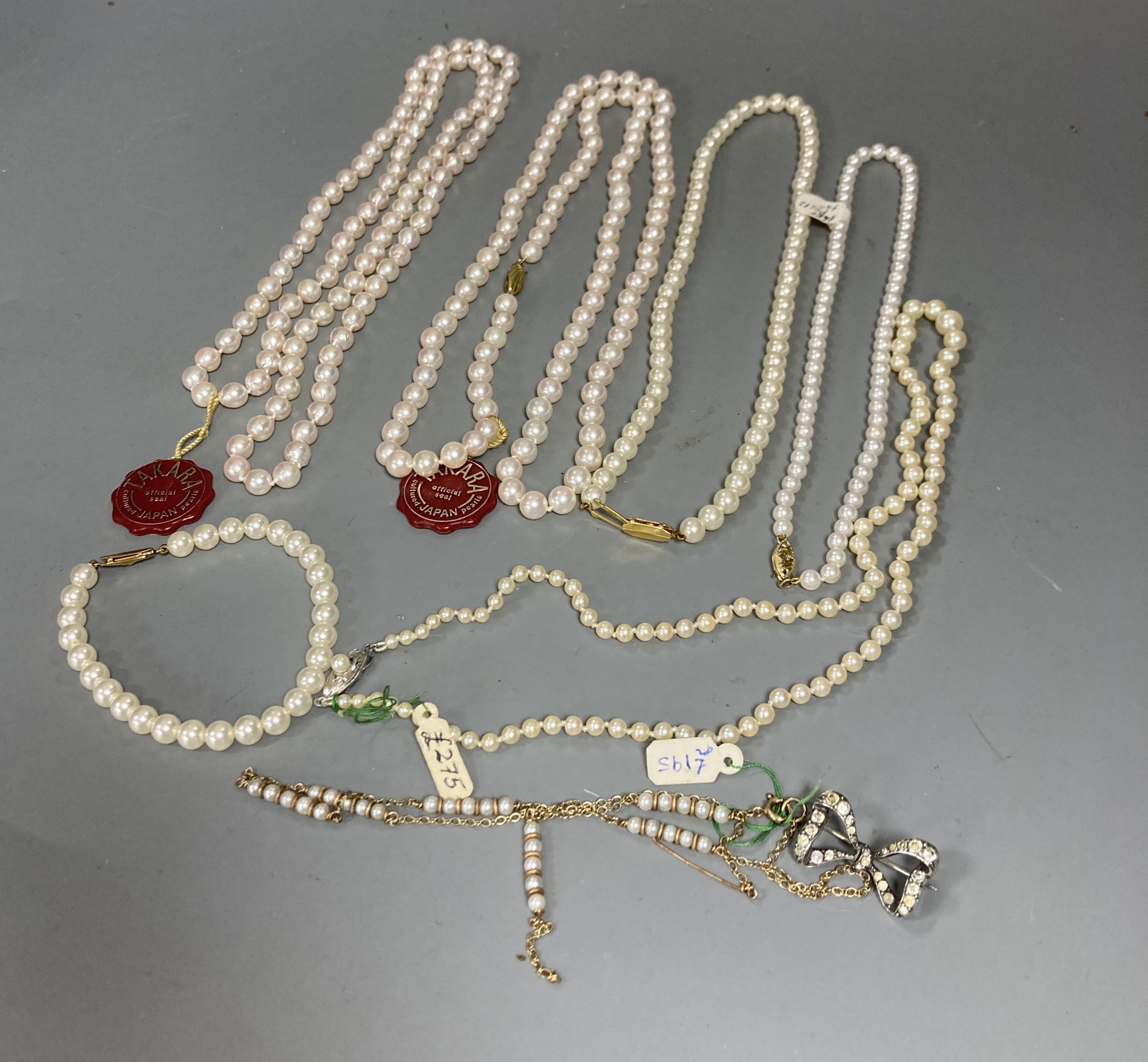 Four assorted modern single strand cultured pearl necklaces, longest 83cm, one other 9ct and cultured pearl necklace(a.f.) and two simulated pearl necklaces.